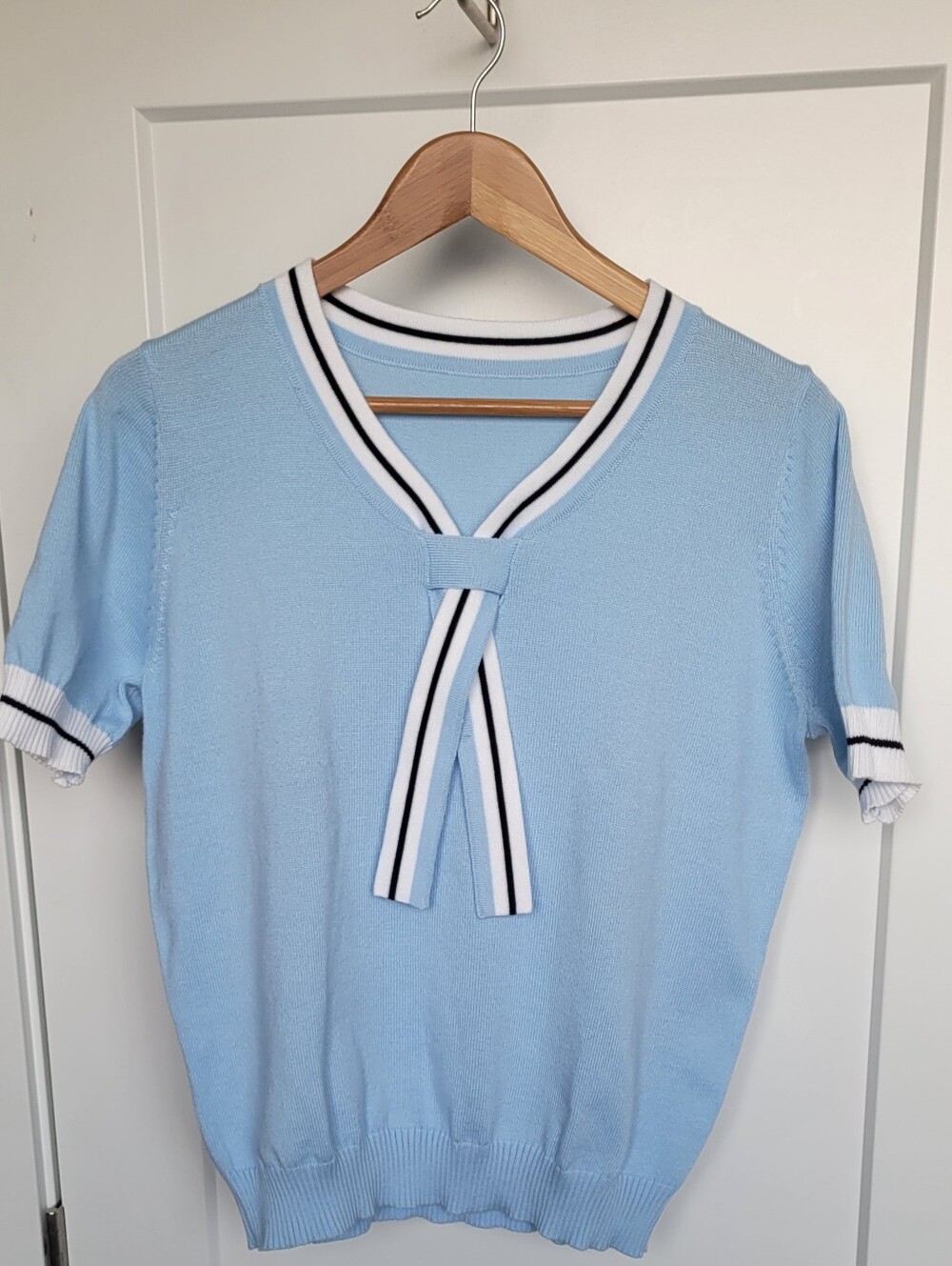 Reposhing. No Label. Light Blue Short-Sleeve Knit Top with Contrast Trim